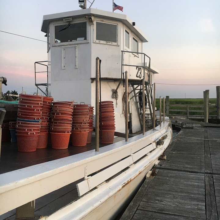 baskets stacked on oysterboat deck