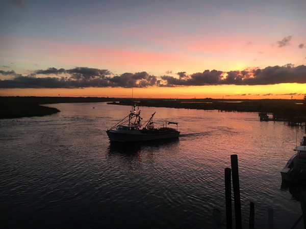 fishing boat on the Nantuxent creek at sunrise